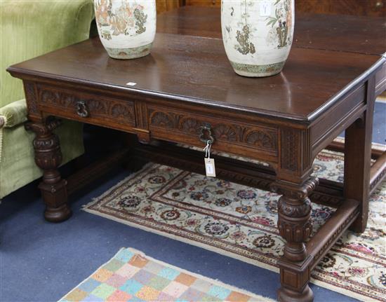 A pair of carved oak side tables, W.137cm